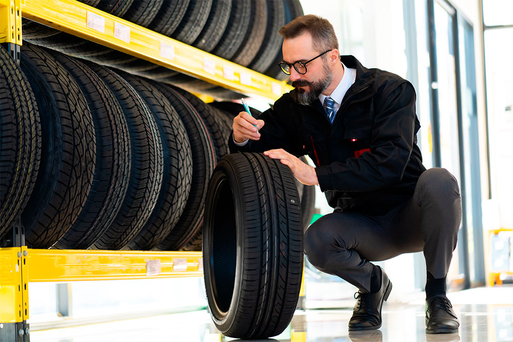 Man Inspecting Tire
